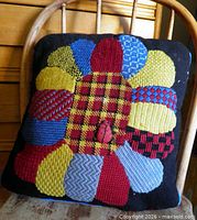 Front view showing entire needlepoint design and ladybug motif