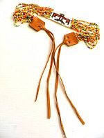 Full view of beaded choker with leather ties displayed flat