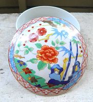 Top view of domed lid showcasing polychrome floral and bamboo design