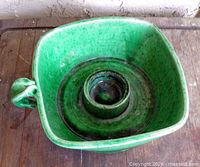 top view showing square bowl, central candle socket, green glaze