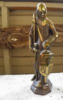 Full view of brass medieval knight statue on base