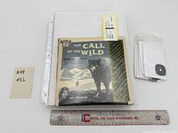 Group showing record sleeves, adapters and scale