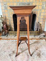 Full view of plant stand showing shape, inlay, lower shelf