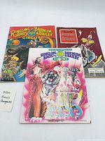 Three circus programs laid out: two Ringling Bros. & Barnum & Bailey and one Shrine Circus