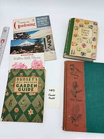Group shot of all five books and pamphlets