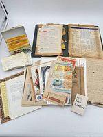 Overall view of recipe cards, loose clippings, folders and notebook