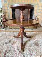Full view of two-tier round wooden side table