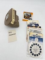 Viewer, stack of reels, sealed reel in foreground