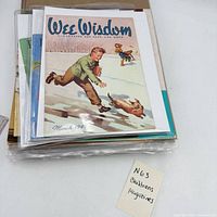 Stack of magazines in sleeves, Wee Wisdom March 1945 on top