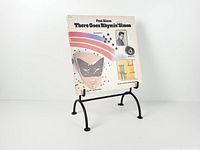 Stand shown holding a 12-inch LP record for scale