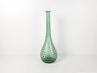 Full view of green hobnail glass genie bottle