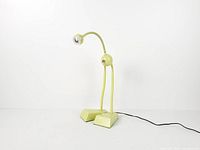 Full frontal view of lime green anthropomorphic desk lamp showing overall design and condition