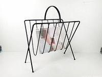 Front view showing V-shaped wire basket holding a magazine