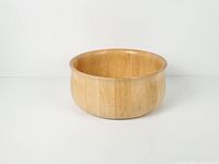 Top angled view of bamboo salad bowl showing shape and interior