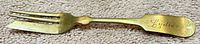 Full view of brass dessert fork