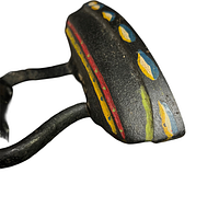 side view showing painted leaf and stripe design on body