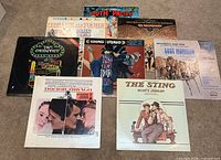 All eight soundtrack and film-theme LPs laid out on carpet