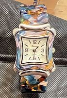 Front view of Geneva watch showing dial and band