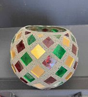 Side view showing mosaic pattern and spherical shape