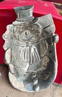 Front view of silver snowman tray showing full design