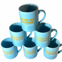 Stacked view of six blue mugs showing slogan text