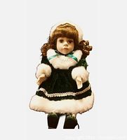 Full view of Samantha doll wearing green velvet dress and bonnet