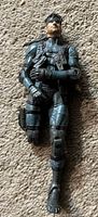 Full view of figure front, shows overall design and wear