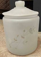 Full view of frosted crystal canister with lid showing floral decal