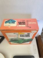 Top of retail box showing product image and branding