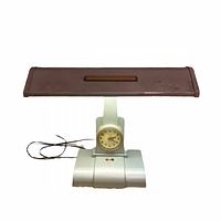 Front view showing entire lamp, shade, clock, cord