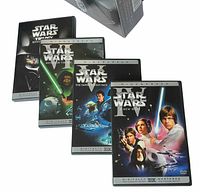 Outer box and four DVD cases fanned out