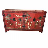 Front view of red lacquer cabinet with scenic panels and black metal hardware