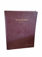 Front of maroon hardcover volume with gilt title