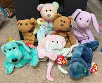 Group photo of all seven Ty Beanie Babies plush animals