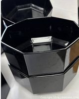Stacked black octagonal bowls showing exterior shape