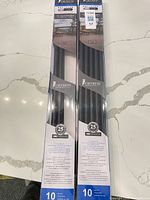 Two Fortress packages containing black round balusters