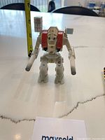 Front view of Excalibur MK VI figure standing upright