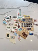 Top-down view of entire assortment of stamps spread on table