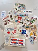 Spread of assorted stamps, Canada82 bag visible