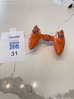 Top view of orange twin-pod cloud car showing overall condition