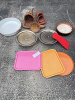 Group shot of all trays, baskets and bowl on ground