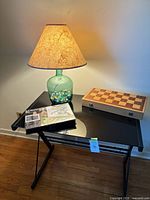 Lamp, chess board box, art kit and folding table overview