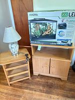Aquarium kit box on cabinet beside side table and lamp