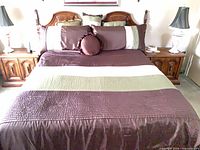 Full view of bed with bedspread and pillows