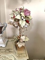 Full view of Den Accessories topiary showing rose, leaves, ornaments, base