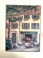 Front view of framed café street scene print