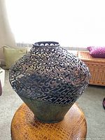 Front view showing scroll cut-outs and color gradient