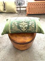 Front view showing embroidery detail and overall pillow shape