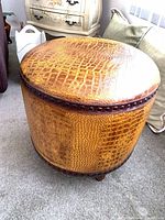 Full view of stool showing faux crocodile upholstery and nailhead trim