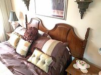 Front view of wooden king headboard attached to bed